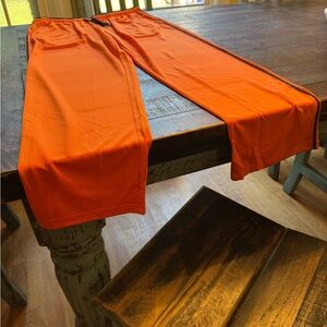 Never worn, thin orange joggers, XL
